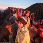 Mandatory Credit: Photo by Bayu Novanta/SOPA Images/Shutterstock (12171162n)
Tenggerese gather during the Yadnya Kasada Festival at crater of Mount Bromo amid the coronavirus pandemic.
Tenggerese people are a Javanese ethnic group in Eastern Java who claimed to be the descendants of the Majapahit princess. Their population of roughly 500,000 is centered in the Bromo Tengger Semeru National Park in eastern Java. The most popular ceremony is the Kasada festival, which makes it the most visited tourist attraction in Indonesia. The festival is the main festival of the Tenggerese people and lasts about a month. On the fourteenth day, the Tenggerese made a journey to Mount Bromo to make offerings of rice, fruits, vegetables, flowers and livestock to throw them into the volcano's caldera. The origin of the festival lies in the 15th century princess named Roro, the principality of Tengger with her husband Joko Seger, and the childless couple asked mountain Gods for help in bearing children. The legend says the Gods granted them 24 children but on the provision that the 25th must be added to the volcano in sacrifice. The 25th child, Kesuma, was finally sacrificed in this way after an initial refusal, and the tradition of throwing sacrifices into the Caldera to appease the mountain Gods continues today.
Yadnya Kasada Festival in Probolinggo, Indonesia - 26 Jun 2021